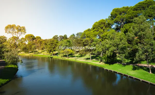 The image displays the tranquil Patawalonga River